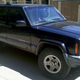 The first Jeep. Rusted bumper. Crows feet paint on the hood. Fender flairs affixed with wood screws.